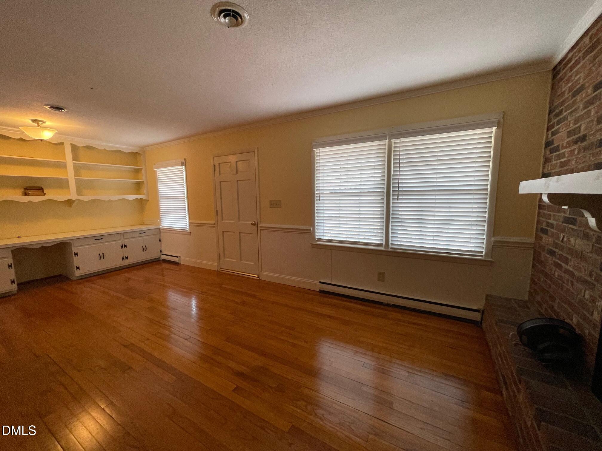 280 Montague Road Angier, NC 27501 - Photo 5 of 28 wooden floor in an empty room with a window