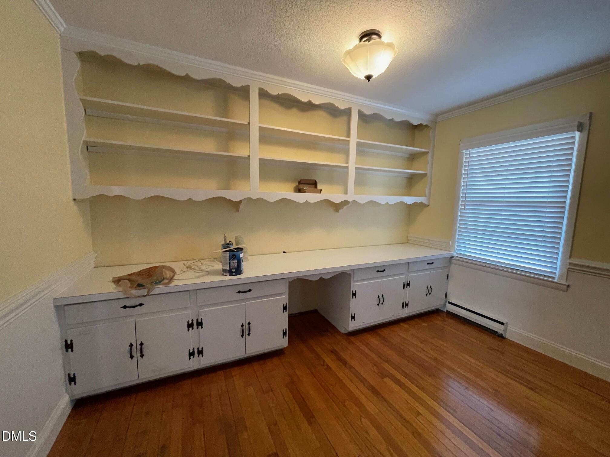 280 Montague Road Angier, NC 27501 - Photo 7 of 28 a room with cabinets and wooden floor