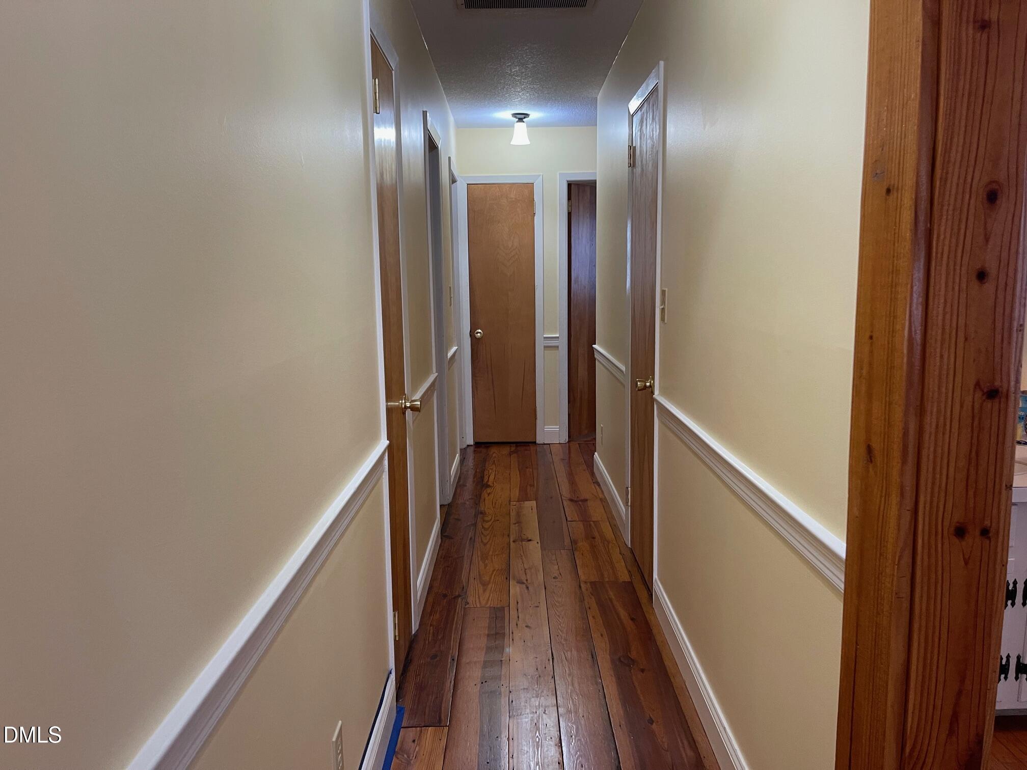 280 Montague Road Angier, NC 27501 - Photo 8 of 28 a view of hallway with wooden floor
