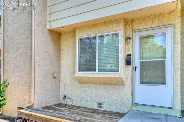 a view of house with wooden floor and a potted plant