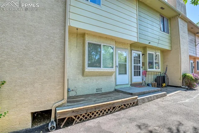 a front view of a house with a large window