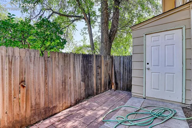 a garden with wooden fence