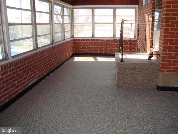 5 Avery Court Rosedale, MD 21237 - Photo 21 of 22 Enclosed Rear Porch overlooking built-in pool