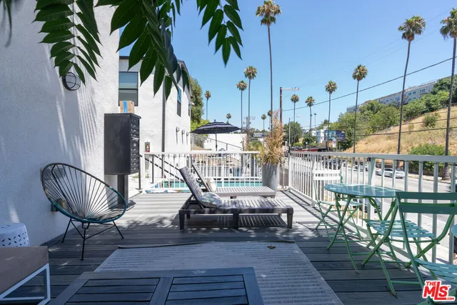 a view of balcony with furniture