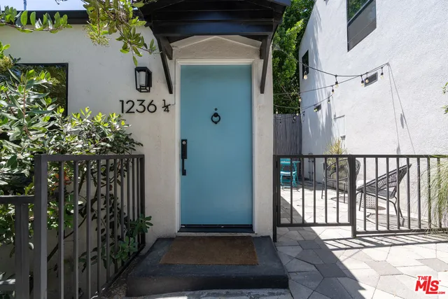 a view of a house with a small yard