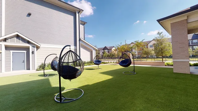 a swimming pool with a table and chairs