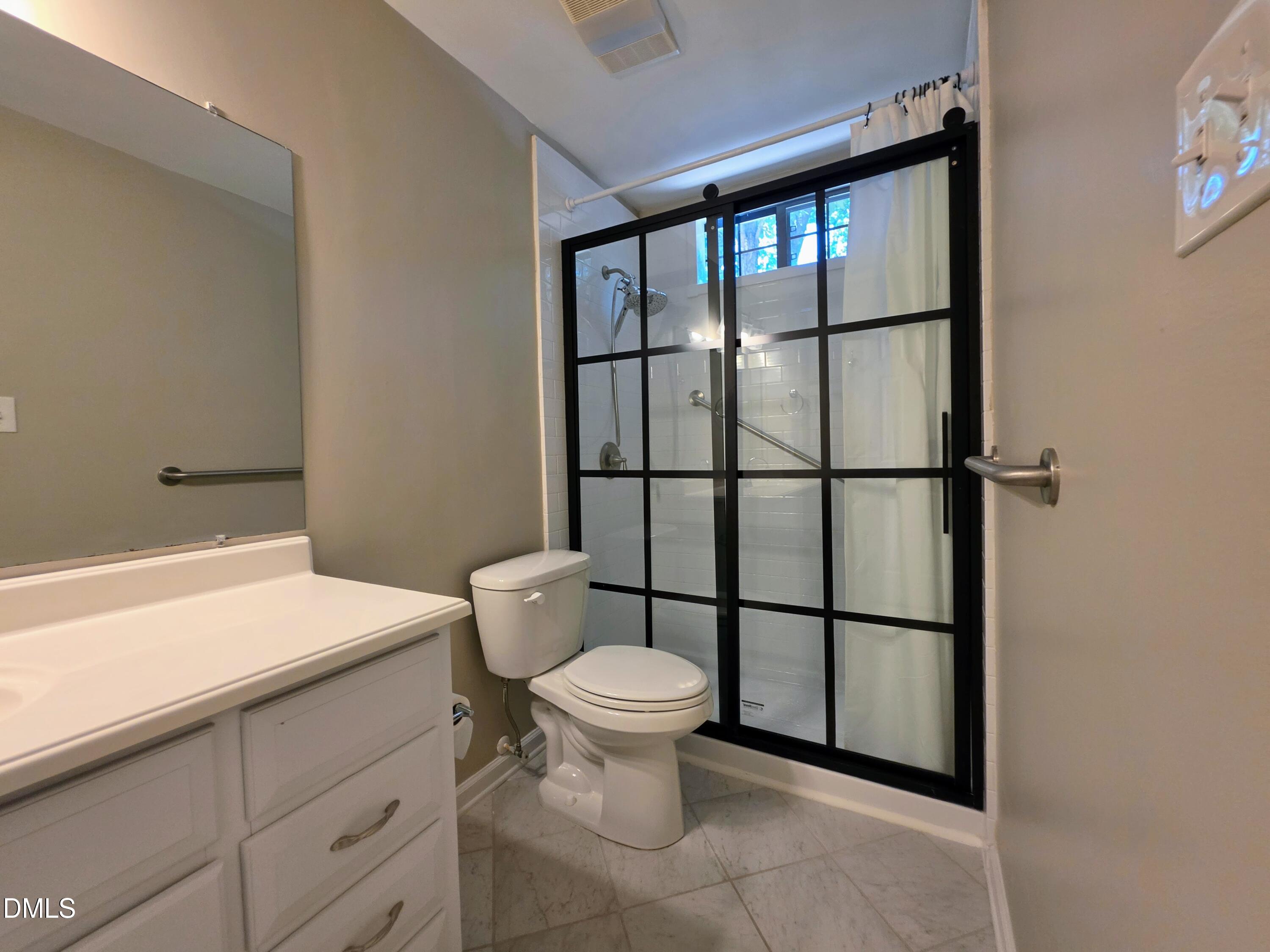 3803 Chimney Ridge Place, Unit 4 Durham, NC 27713 - Photo 11 of 16 a bathroom with a toilet and a sink