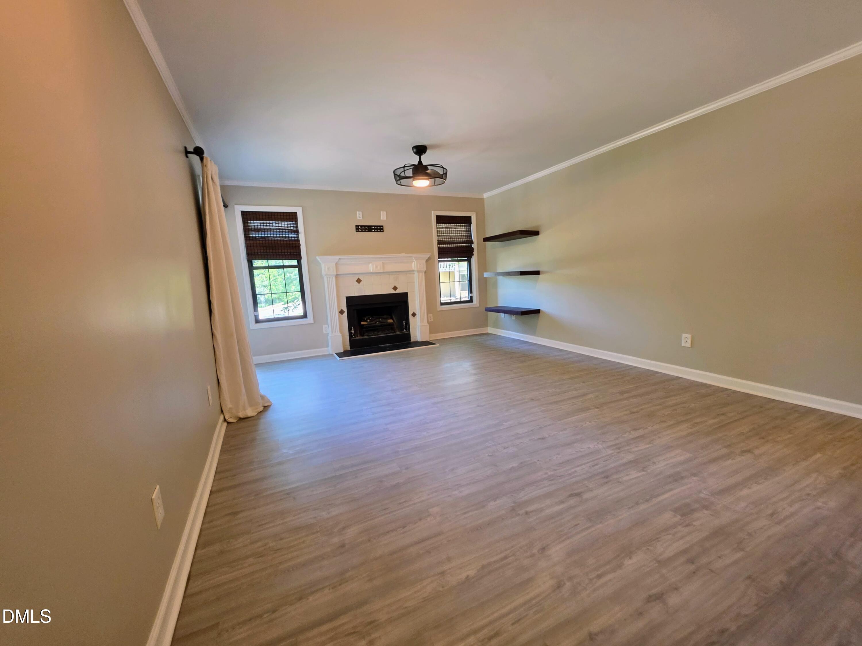 3803 Chimney Ridge Place, Unit 4 Durham, NC 27713 - Photo 2 of 16 wooden floor in an empty room with a fireplace