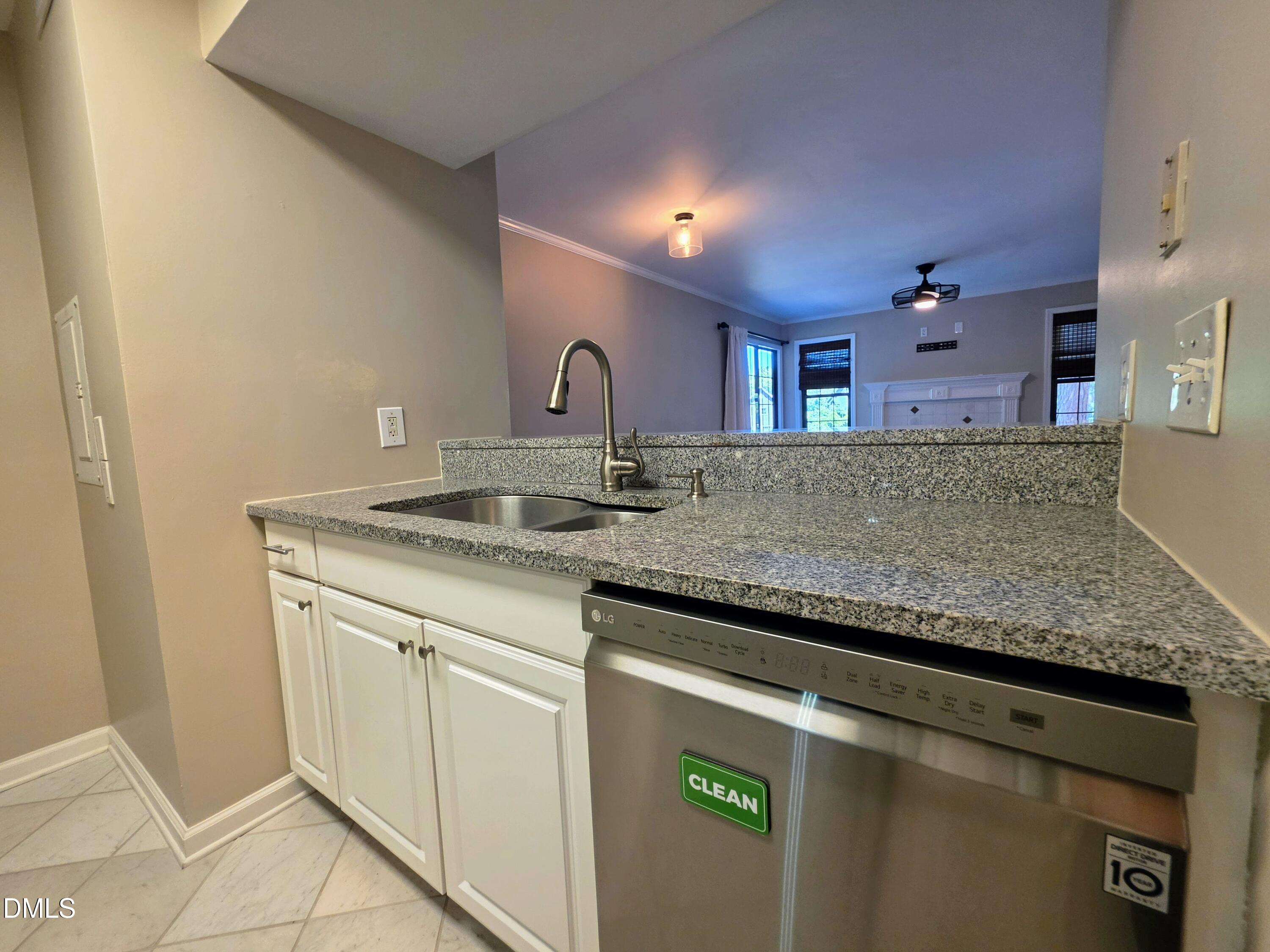3803 Chimney Ridge Place, Unit 4 Durham, NC 27713 - Photo 7 of 16 a sink with granite countertop a sink and cabinets