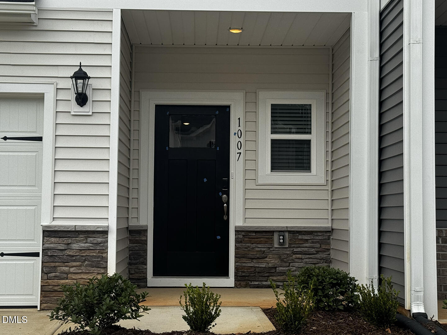 1007 Winding Spg Drive Mebane, NC 27302 - Photo 3 of 32 a view of front door and potted plants