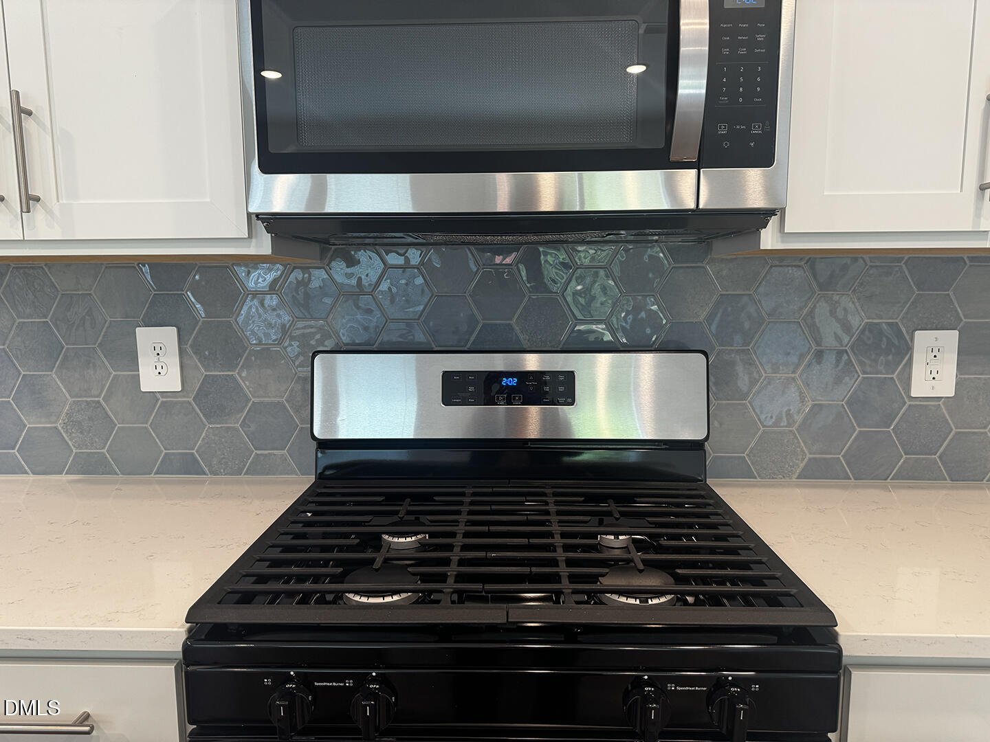 1007 Winding Spg Drive Mebane, NC 27302 - Photo 10 of 32 a stove top oven sitting inside of a kitchen