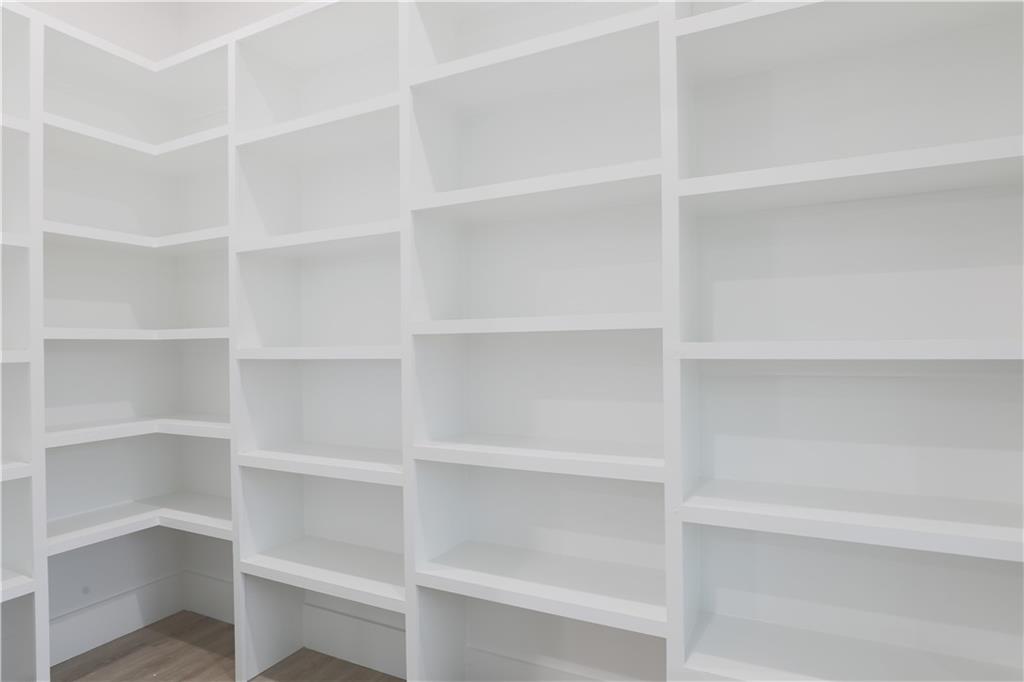 1341 Wheeler Creek Road Maysville, GA 30558 - Photo 23 of 65 a view of walk in closet with empty racks