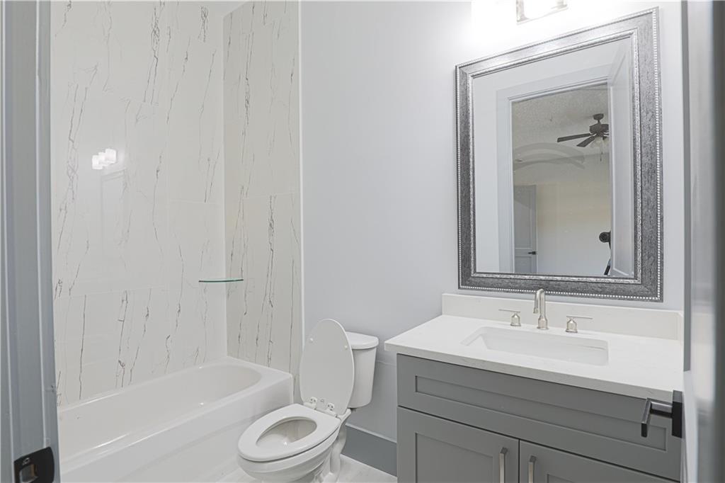 1341 Wheeler Creek Road Maysville, GA 30558 - Photo 33 of 65 a bathroom with a sink toilet and shower