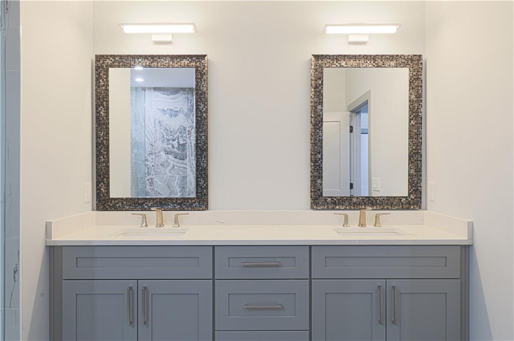 1341 Wheeler Creek Road Maysville, GA 30558 - Photo 46 of 65 a bathroom with a sink and a mirror
