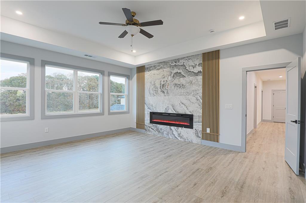 1341 Wheeler Creek Road Maysville, GA 30558 - Photo 55 of 65 a view of an empty room with a window and wooden floor