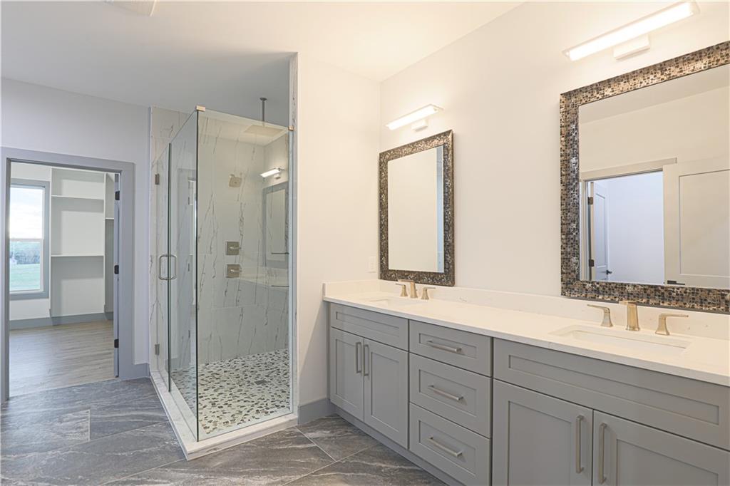 1341 Wheeler Creek Road Maysville, GA 30558 - Photo 58 of 65 a bathroom with double sink and shower