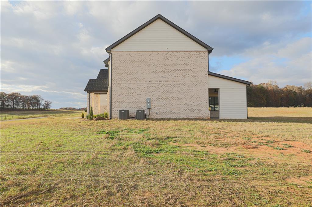 1341 Wheeler Creek Road Maysville, GA 30558 - Photo 61 of 65 a view of a house with a yard