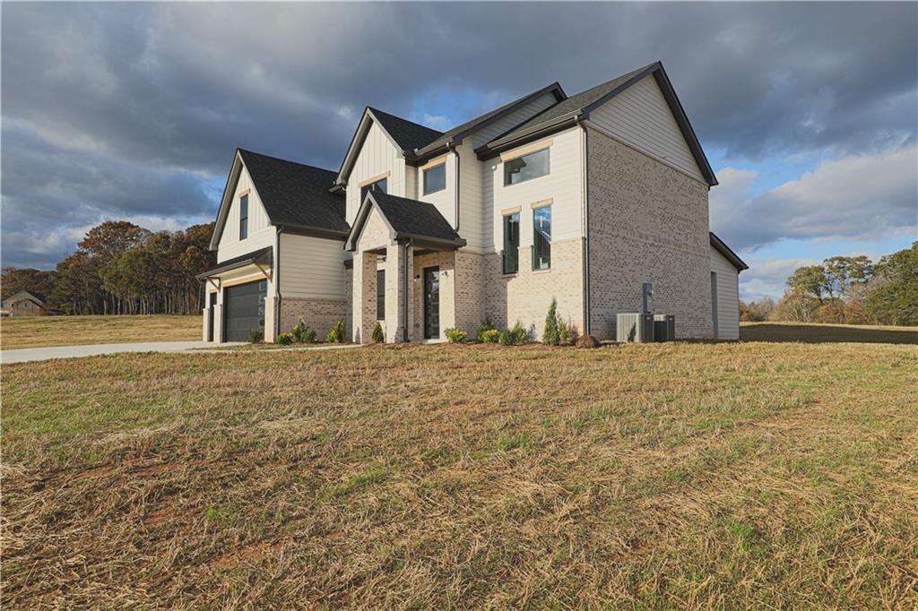 1341 Wheeler Creek Road Maysville, GA 30558 - Photo 64 of 65 a front view of a house with a yard