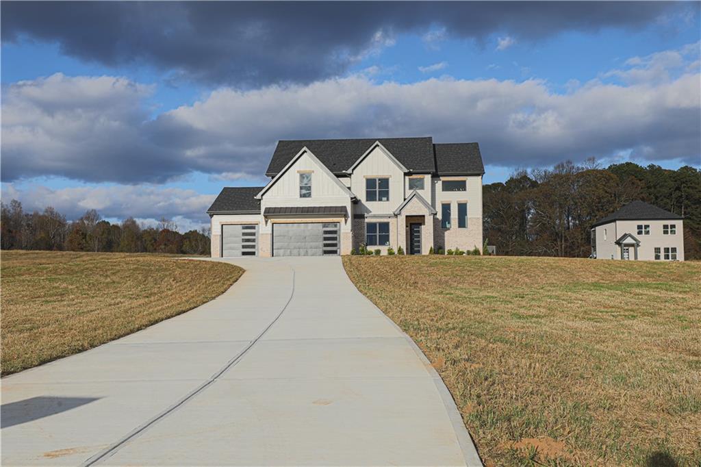 1341 Wheeler Creek Road Maysville, GA 30558 - Photo 7 of 65 a front view of a house with a yard