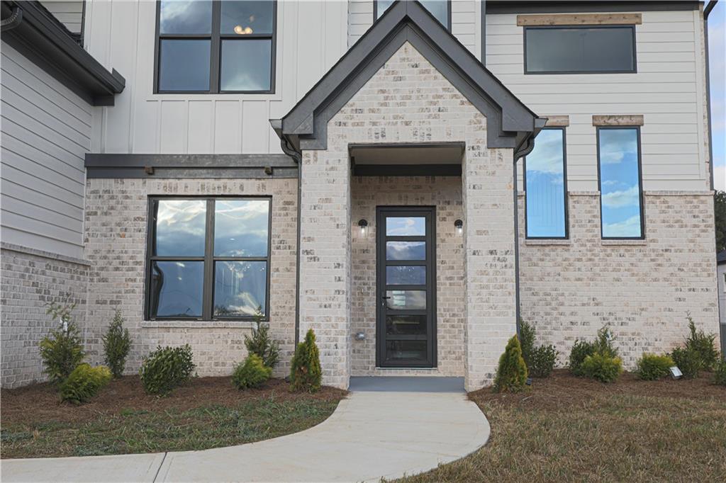 1341 Wheeler Creek Road Maysville, GA 30558 - Photo 8 of 65 a front view of a house with a yard