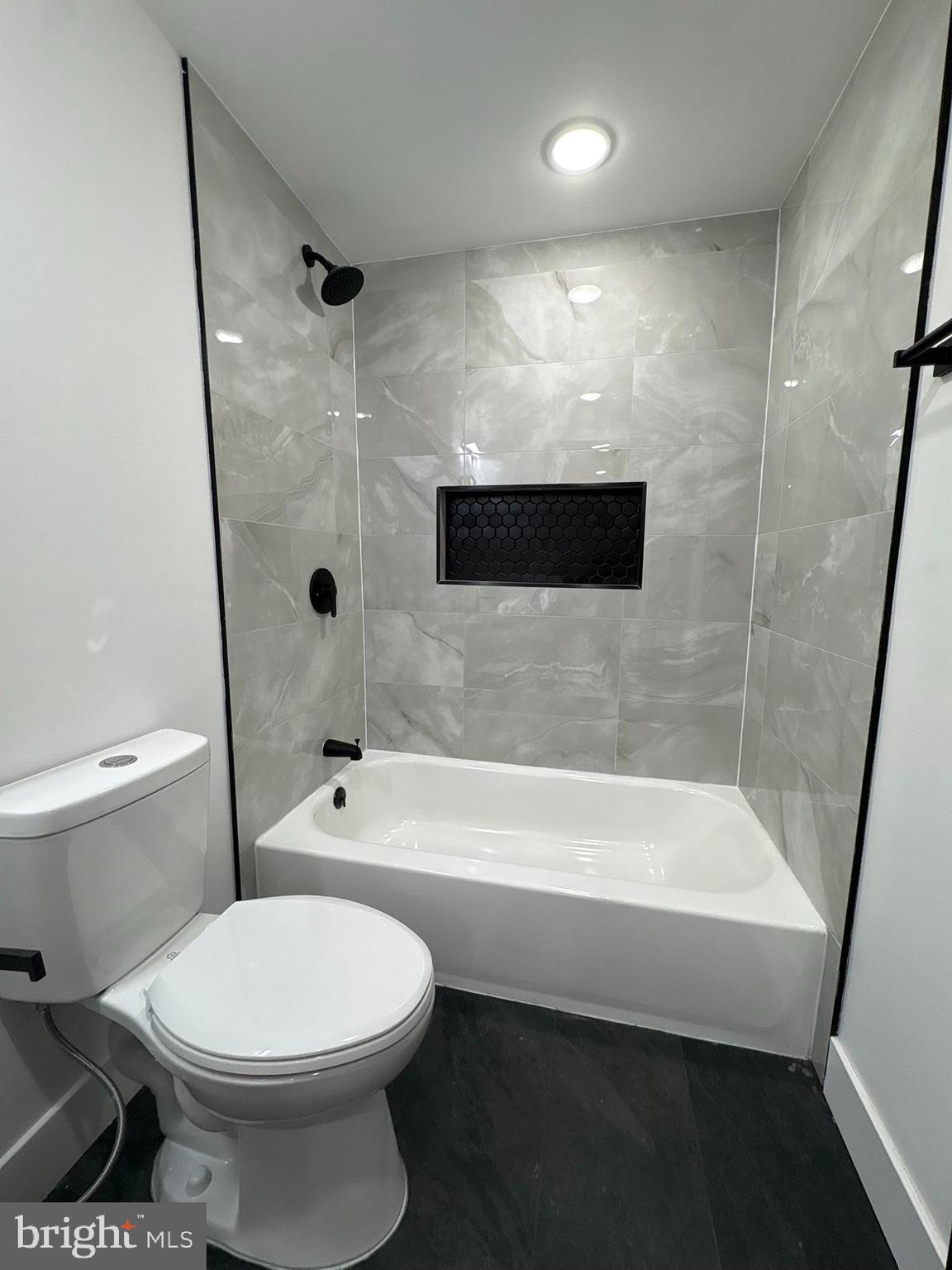 5510 Matthews Street, Unit A Philadelphia, PA 19138 - Photo 6 of 6 a bathroom with a toilet and a bath tub