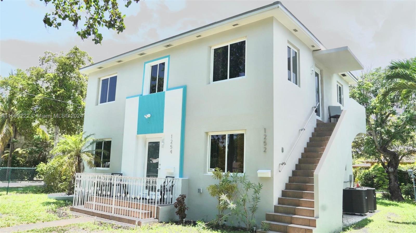 1254 Southwest 13th Street, Unit 1254 Miami, FL 33145 - Photo 1 of 14 a front view of a house with a yard