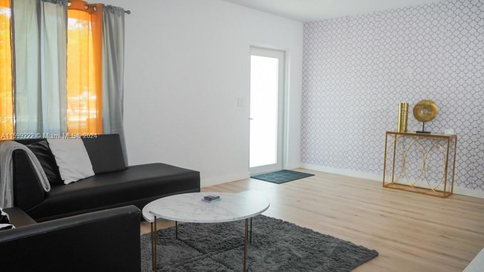 1254 Southwest 13th Street, Unit 1254 Miami, FL 33145 - Photo 5 of 14 a living room with furniture and a window