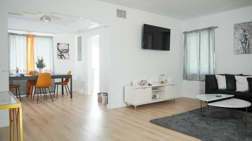 1254 Southwest 13th Street, Unit 1254 Miami, FL 33145 - Photo 7 of 14 a living room with furniture and a flat screen tv