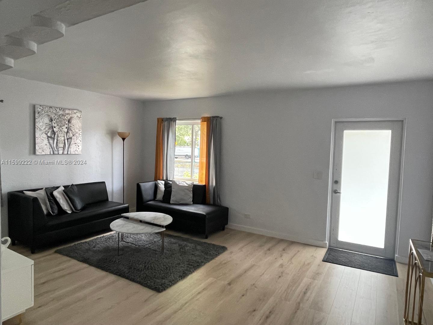 1254 Southwest 13th Street, Unit 1254 Miami, FL 33145 - Photo 8 of 14 a living room with furniture and a window
