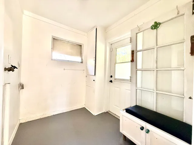 a view of a closet area with ceiling fan