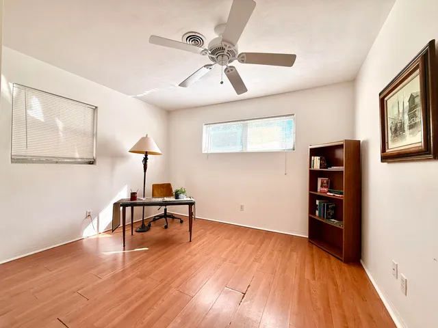 a view of a livingroom with furniture and wooden floor