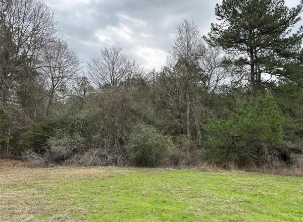 a view of a field with an outdoor space