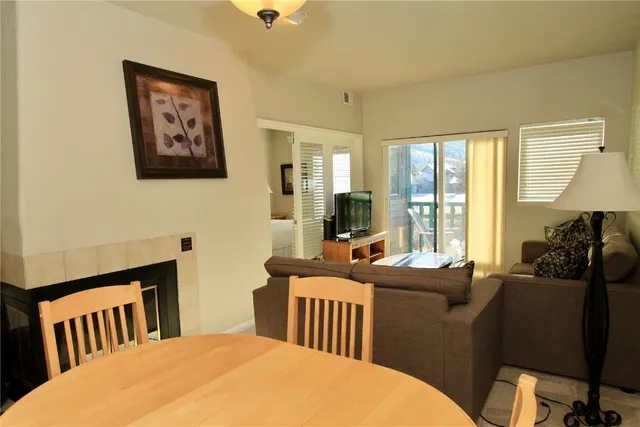 a bedroom with two beds and a large window