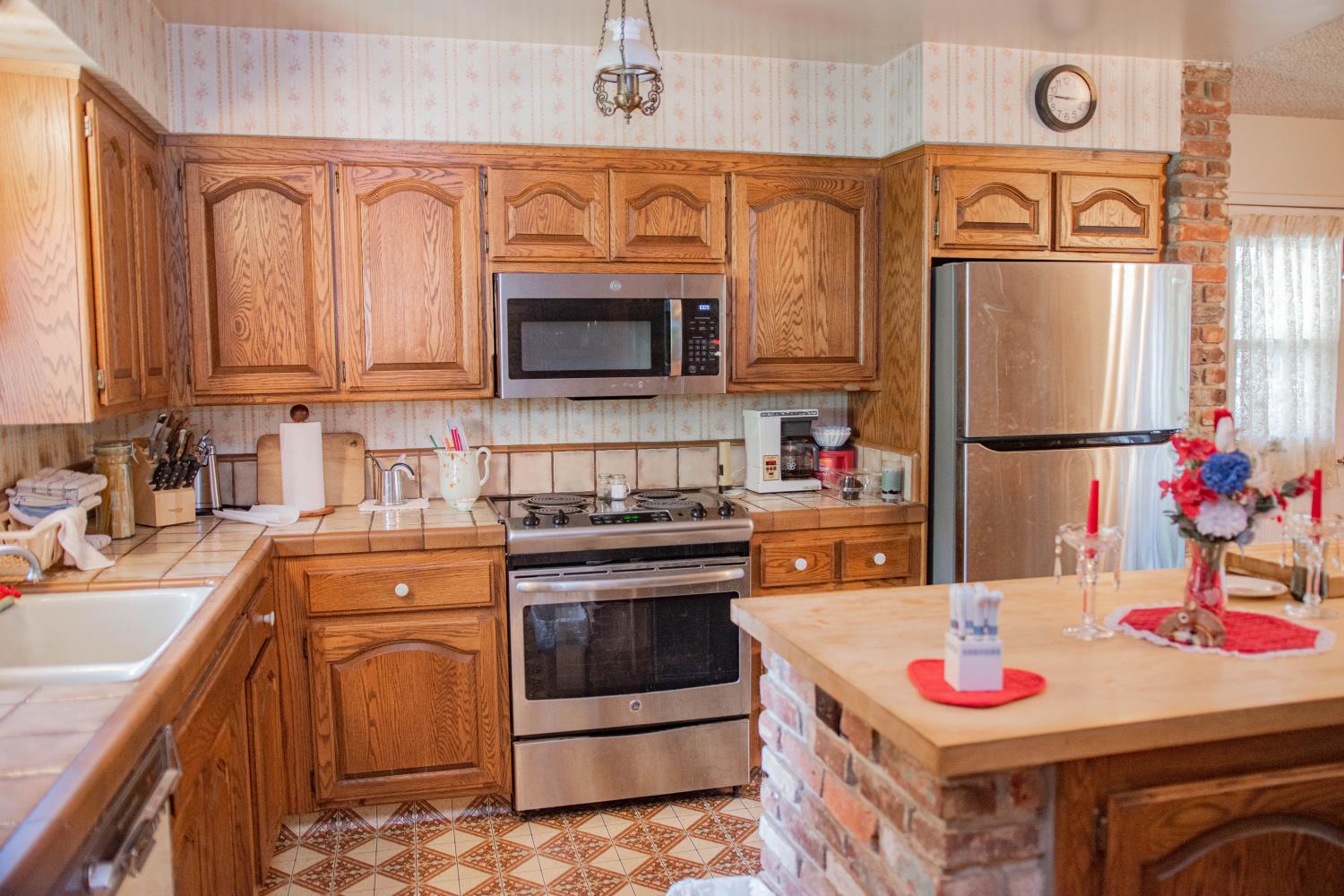 7380 Wentworth Springs Road Georgetown, CA 95634 - Photo 12 of 48 a kitchen with stainless steel appliances granite countertop a stove top oven a sink and dishwasher