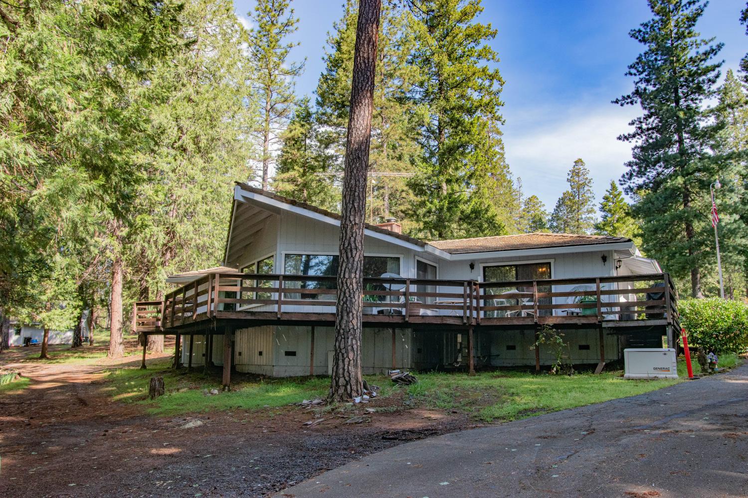 7380 Wentworth Springs Road Georgetown, CA 95634 - Photo 2 of 48 a front view of a house with a garden and trees