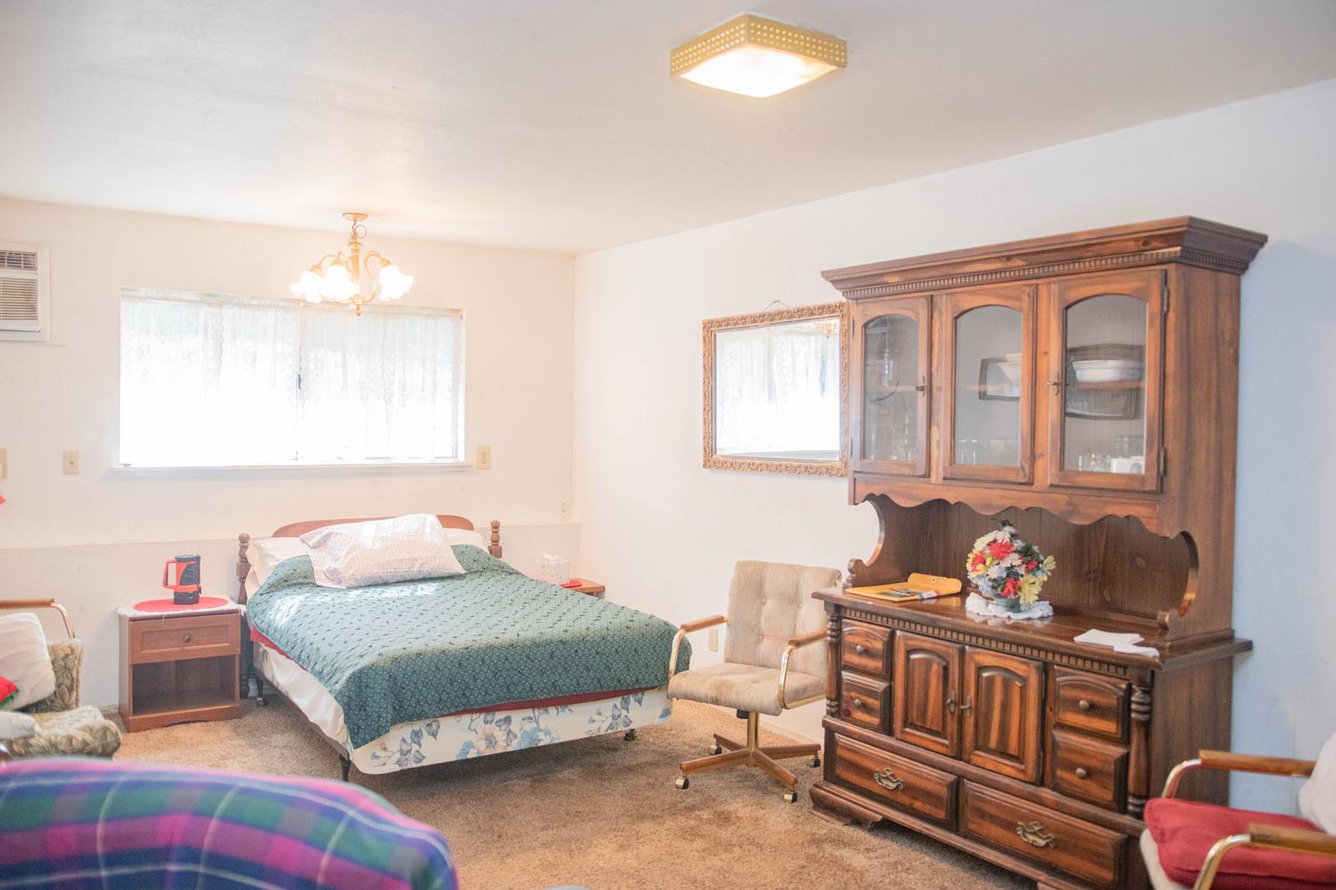 7380 Wentworth Springs Road Georgetown, CA 95634 - Photo 27 of 48 a bedroom with a bed and a window