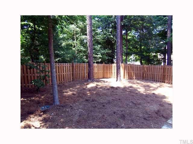 6617 Rainwater Road Raleigh, NC 27615 - Photo 10 of 12 The yard backs to the wooded common area, which affords even more privacy. Other amenities & updates include: security system, in ground sprinkler system on a separate water meter, fresh interior paint , new windows & new HVAC 2002!