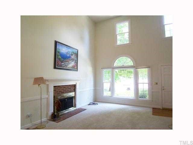6617 Rainwater Road Raleigh, NC 27615 - Photo 1 of 12 The welcoming covered front porch leads to the 2-story tall hardwd-floored Entry w/coat closet & staircase open to the 2-story tall Living Rm w/brick wood burning FP, neutral carpet, ceiling fan, chair rail molding & recessed lights.