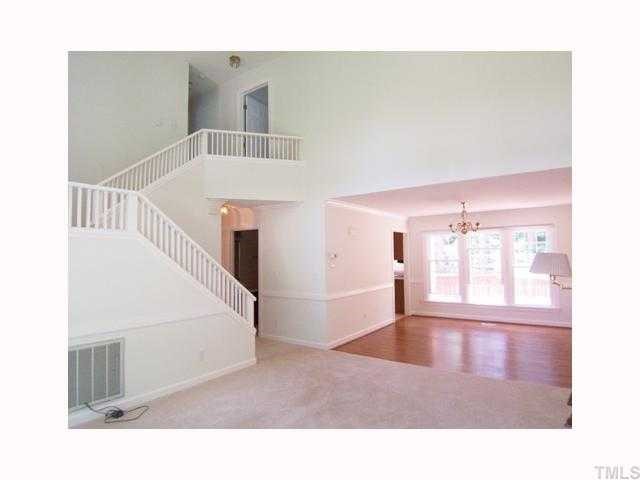 6617 Rainwater Road Raleigh, NC 27615 - Photo 2 of 12 View of the 2-story tall Living Rm open to the formal Dining Rm.