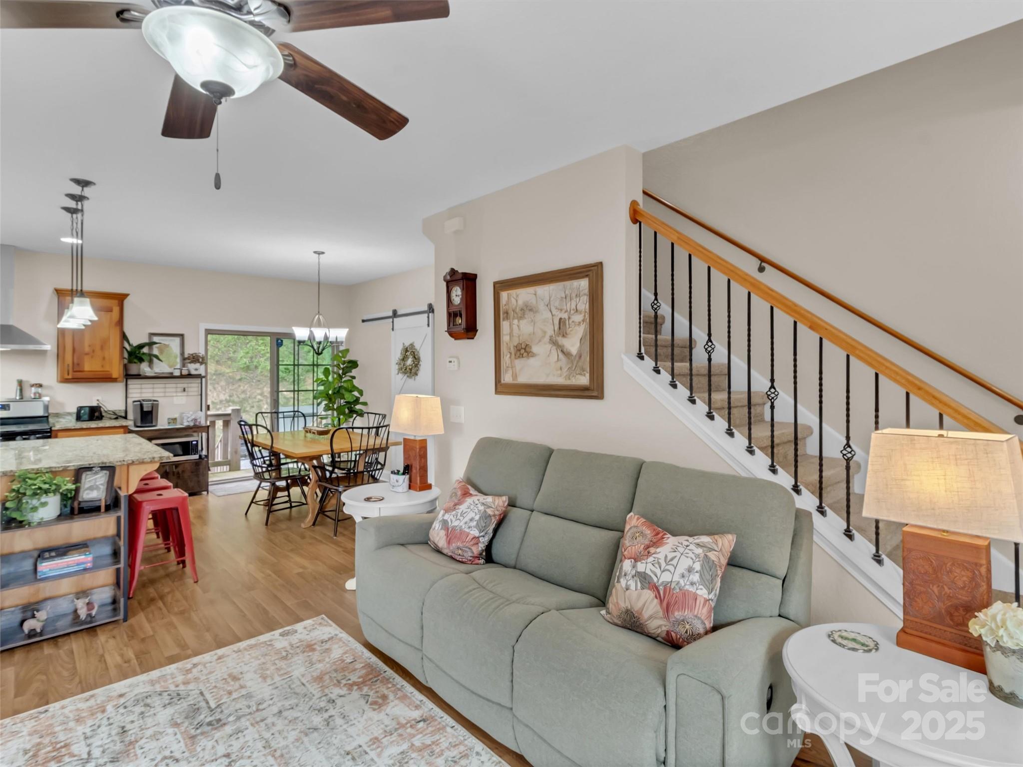 4823 Max Patch Road Clyde, NC 28721 - Photo 14 of 47 a living room with furniture kitchen view and a large window