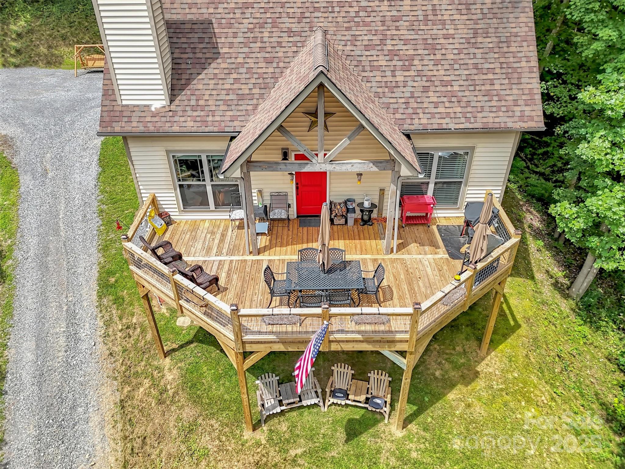4823 Max Patch Road Clyde, NC 28721 - Photo 23 of 47 an aerial view of a house with swimming pool