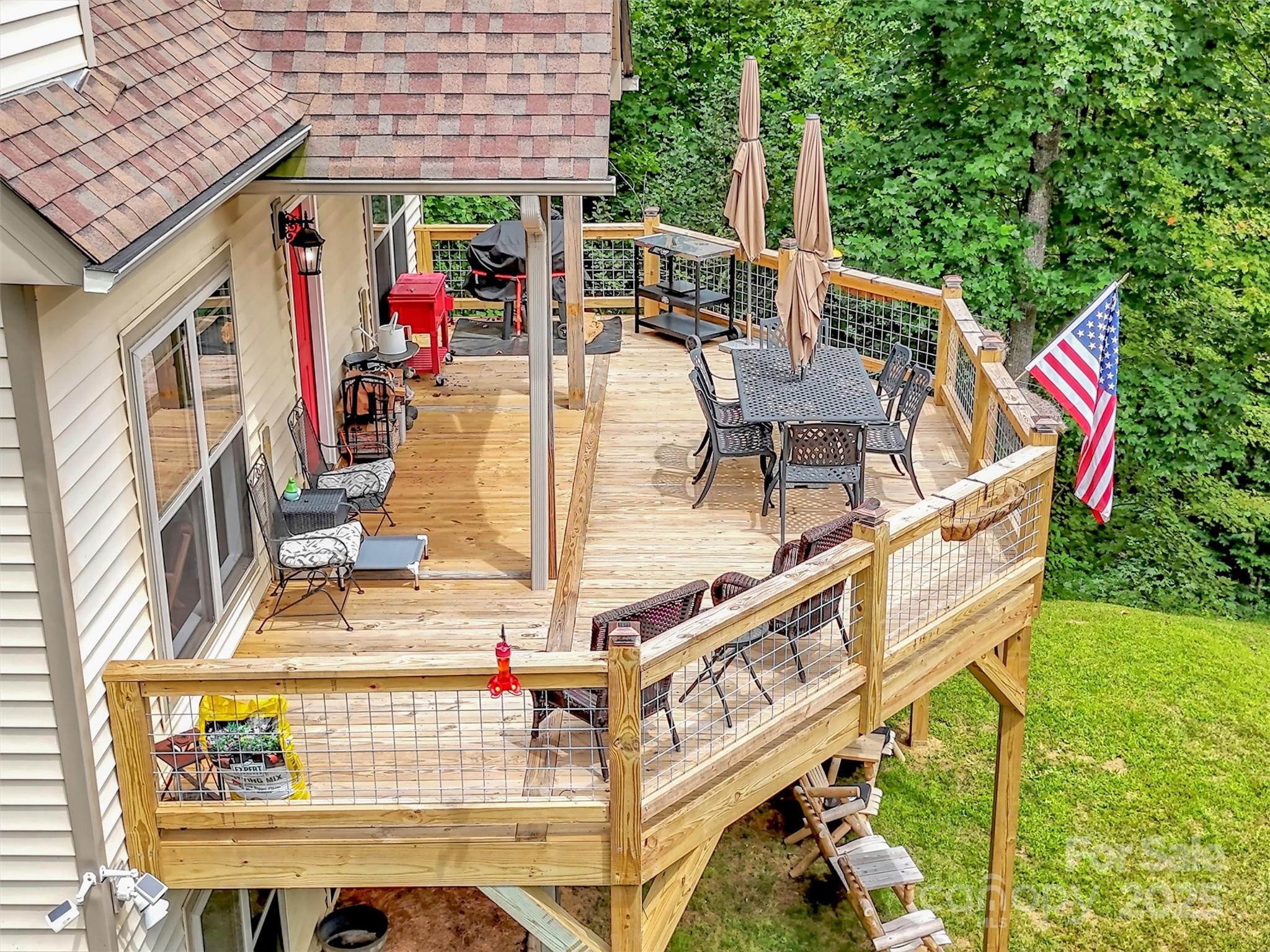 4823 Max Patch Road Clyde, NC 28721 - Photo 29 of 47 a view of a chairs and table in the patio with a swimming pool