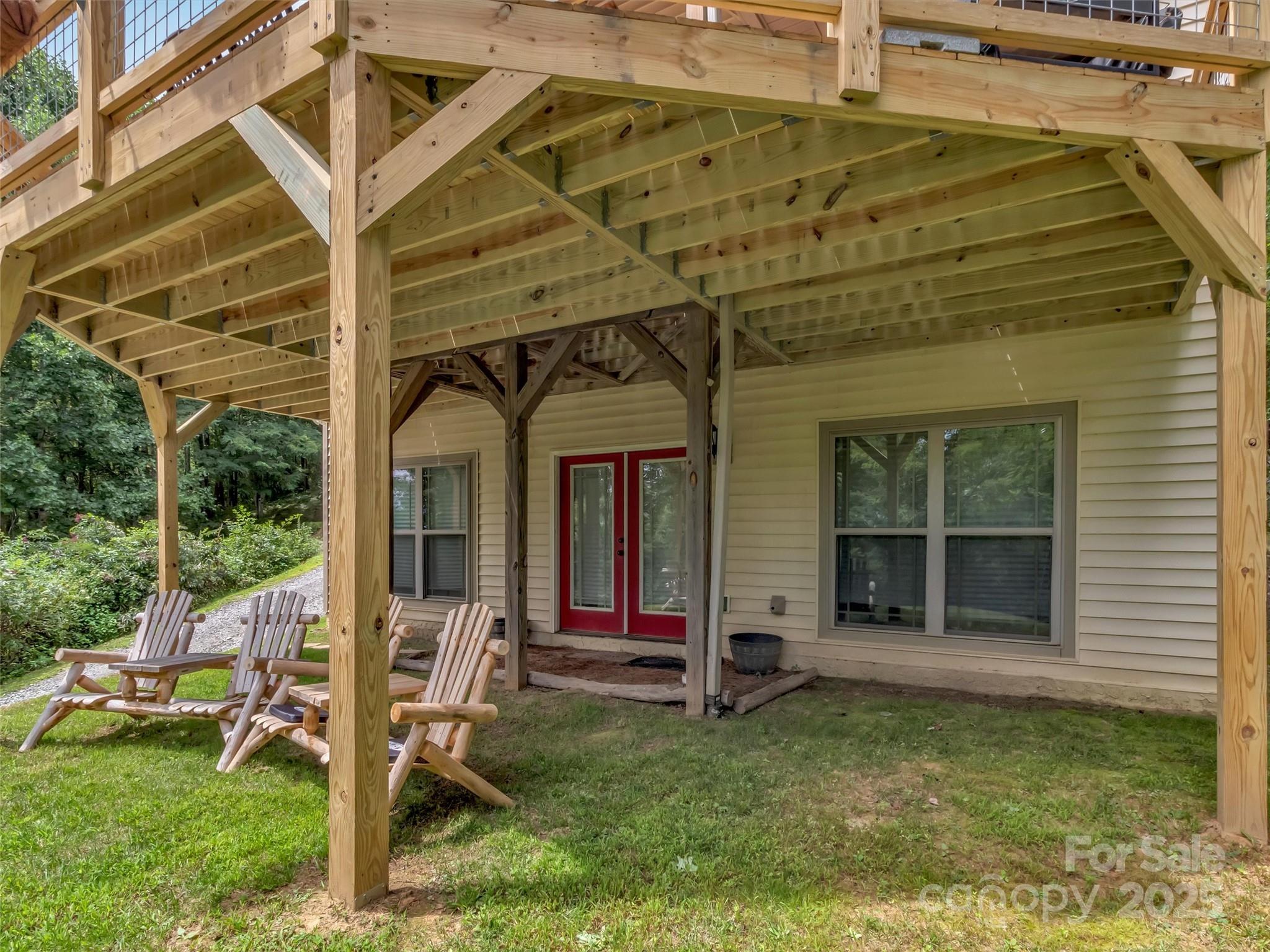 4823 Max Patch Road Clyde, NC 28721 - Photo 33 of 47 a view of a house with backyard porch and wooden floor