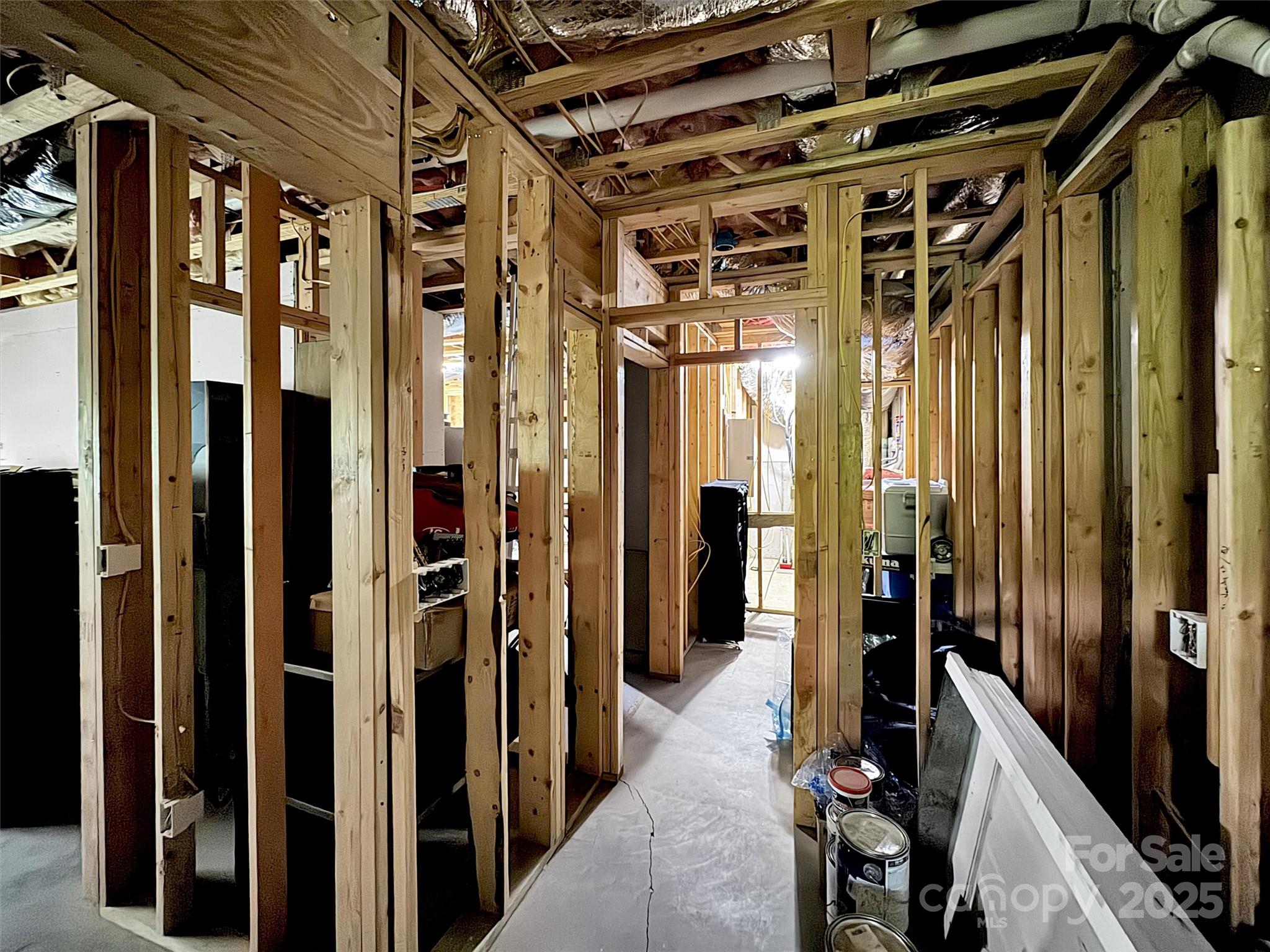 4823 Max Patch Road Clyde, NC 28721 - Photo 36 of 47 a view of a hallway with wooden walls and staircase