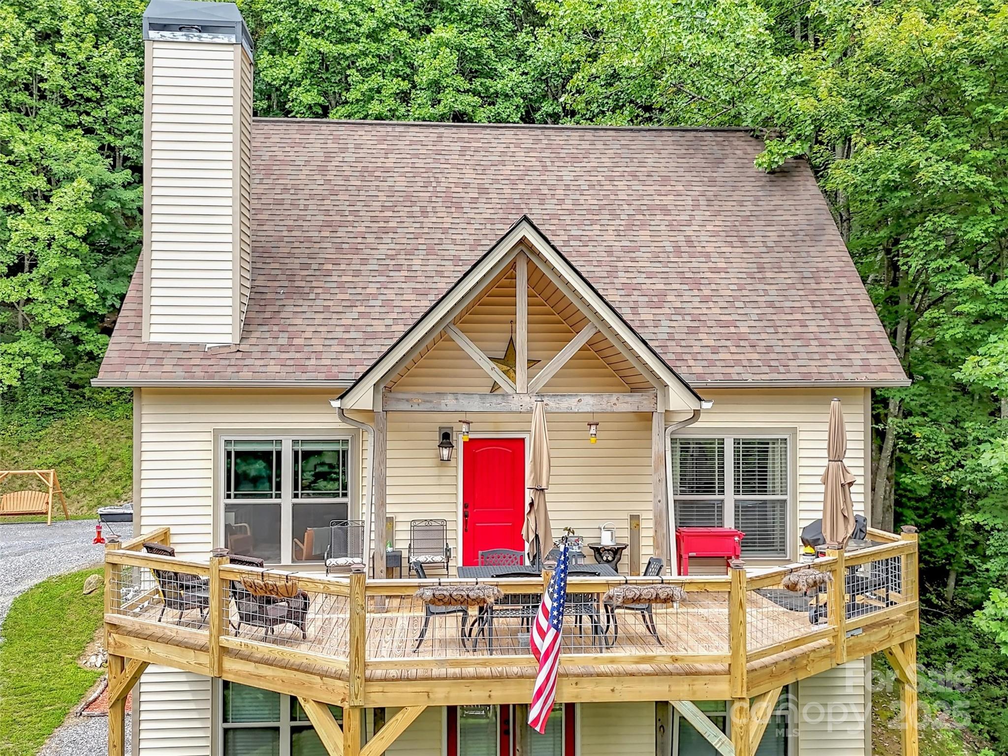 4823 Max Patch Road Clyde, NC 28721 - Photo 40 of 47 a house view with a sitting space and garden