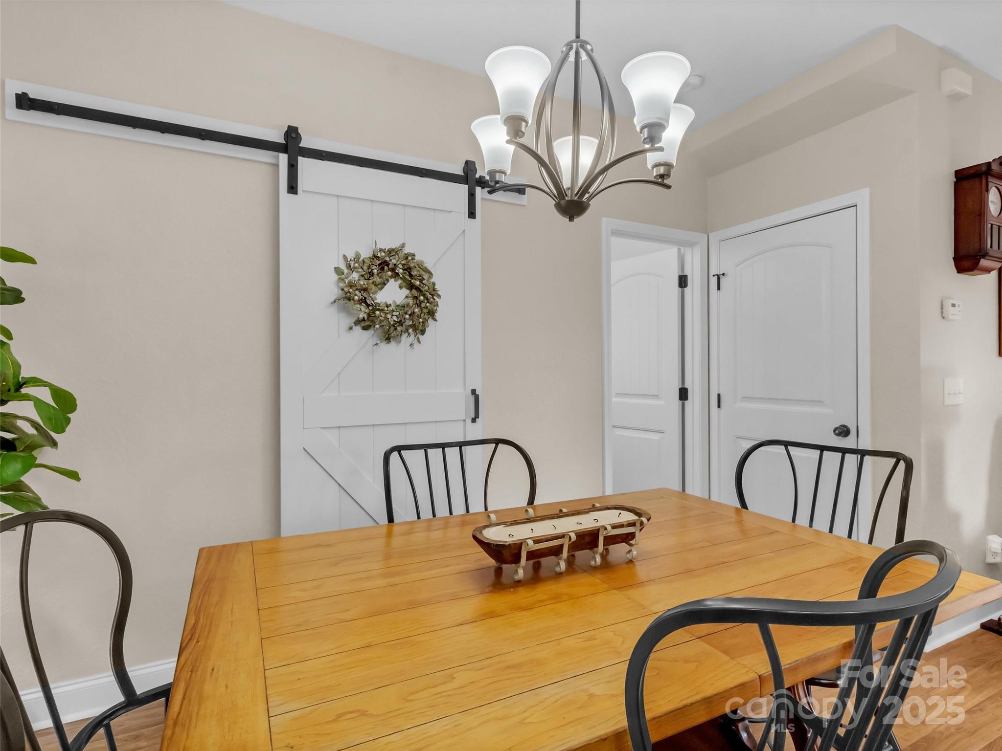 4823 Max Patch Road Clyde, NC 28721 - Photo 6 of 47 a bedroom with furniture and a chandelier