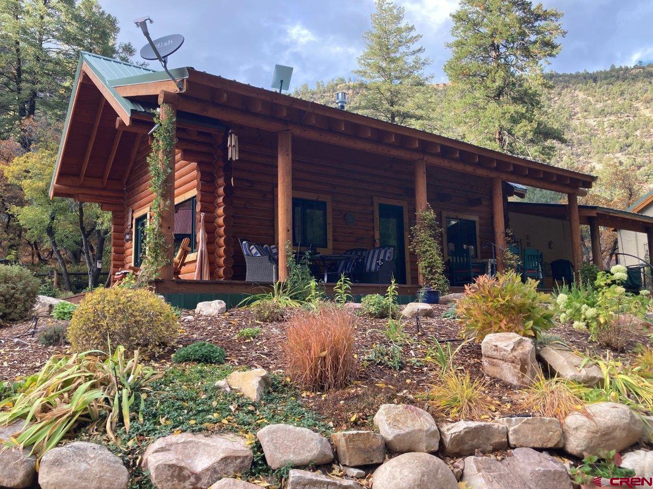 a view of a house with potted plants