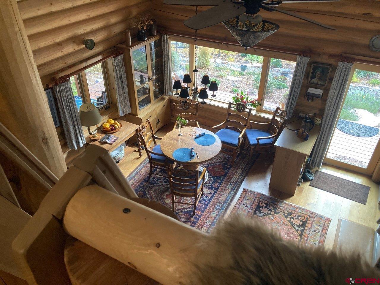 68 Sanborn Park Road Norwood, CO 81423 - Photo 18 of 33 a living room with furniture and a large window