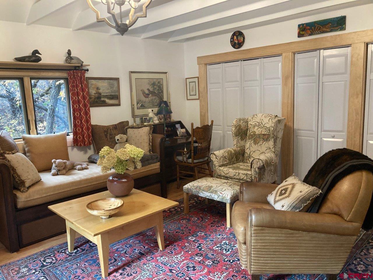 68 Sanborn Park Road Norwood, CO 81423 - Photo 29 of 33 a living room with furniture and a large window