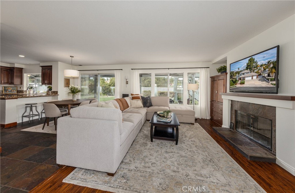 1951 Annapolis Circle Corona, CA 92881 - Photo 16 of 42 a living room with furniture and a fireplace